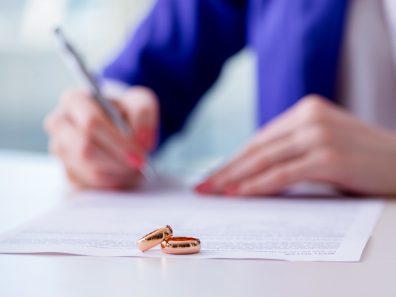 Woman signing prenuptial agreement